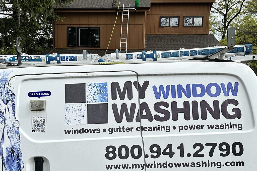 power washer cleaning residential house