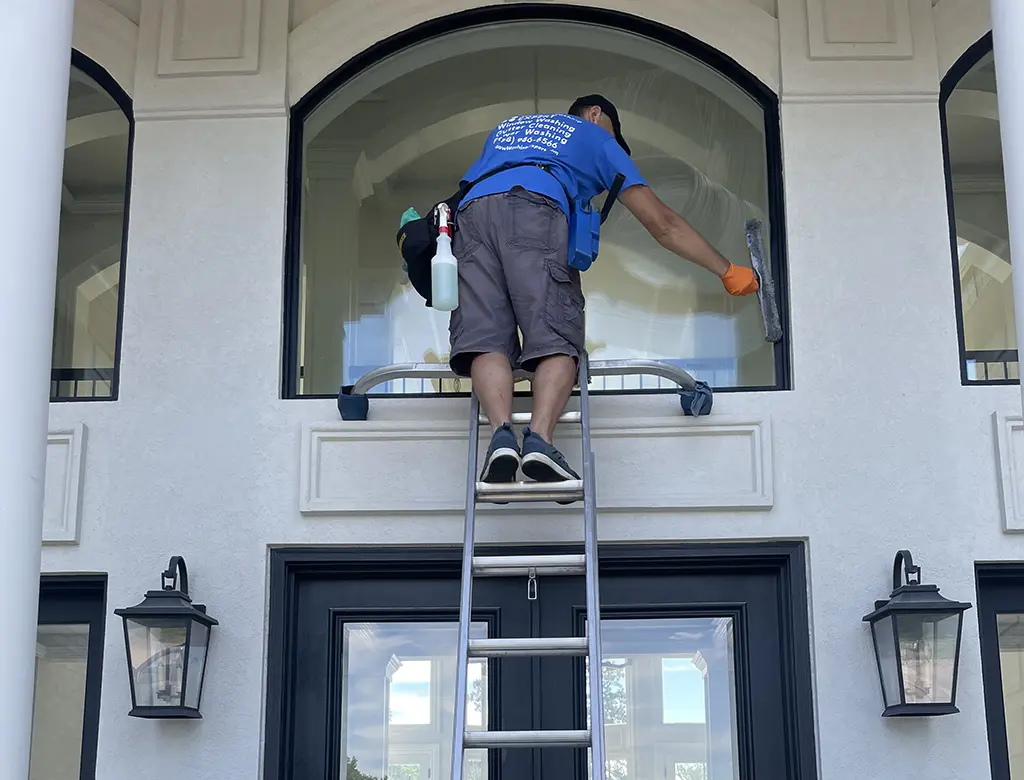 window washer working on the ladder