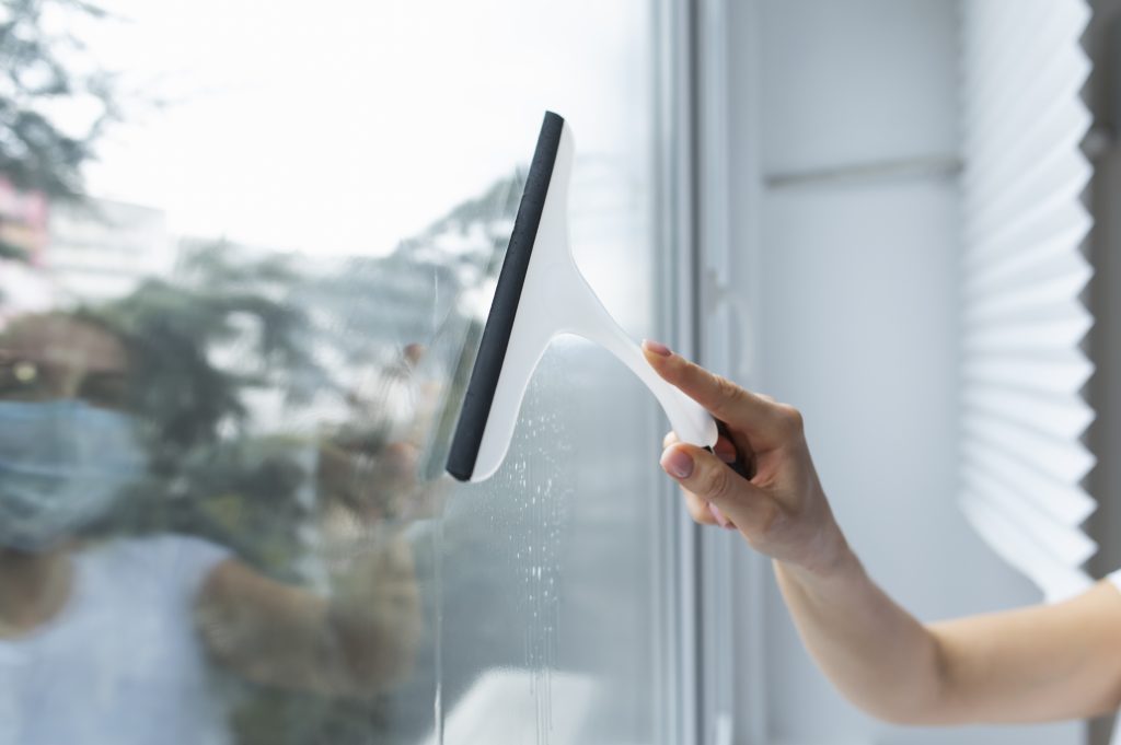 Person cleaning a window