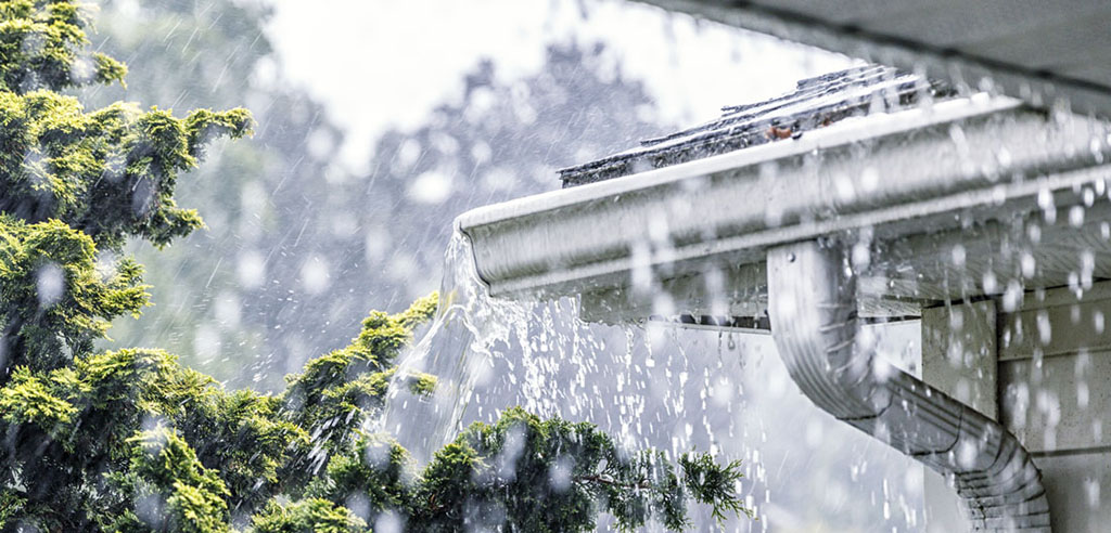 gutters overflowing in the rain