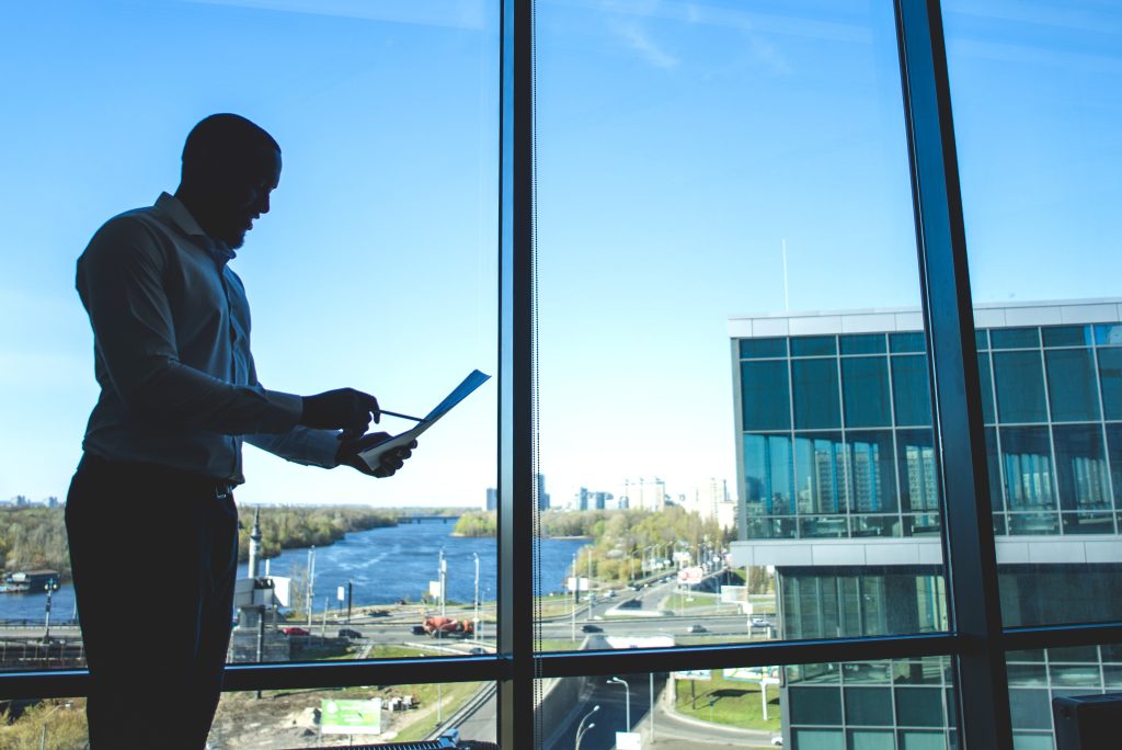 silhouette businessman holding document