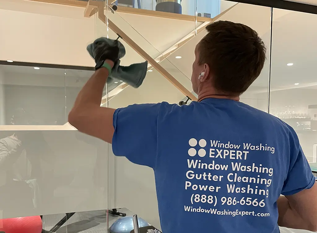 window washing expert cleaning window