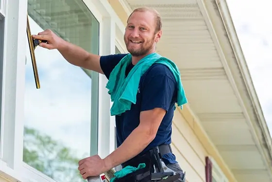 My Window Washing technician cleaning windows at a home in Chicago