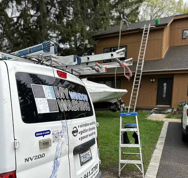 Professional gutter cleaning process at a Chicago-area home