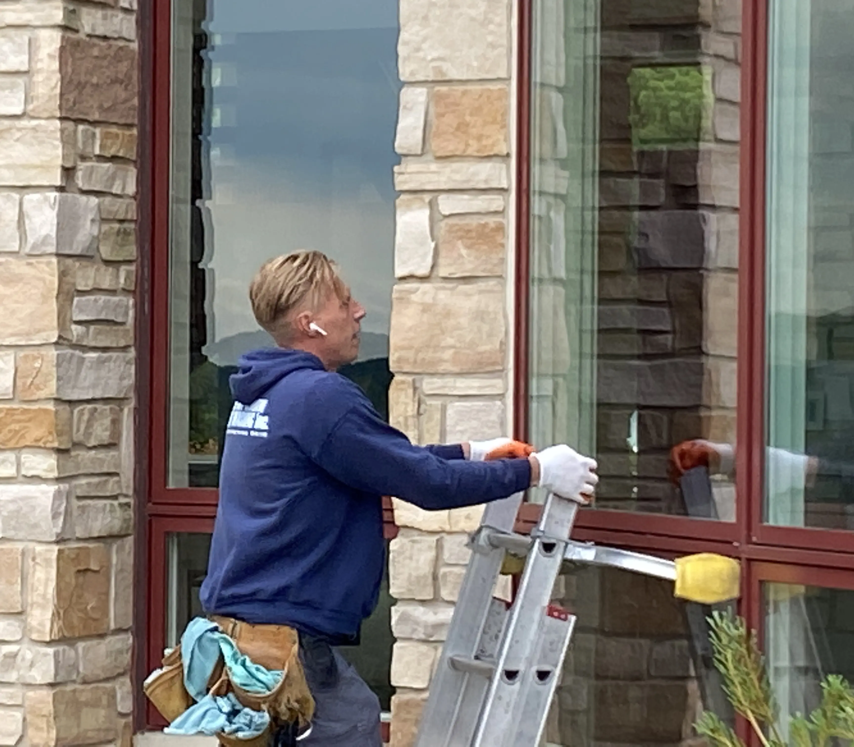 Professional window cleaner at work