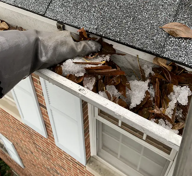 Winter gutter cleaning at a Chicago-area home