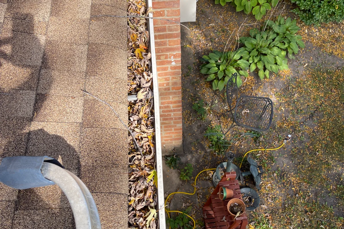 Gutter Cleaning before — Arlington Heights IL 2-story house