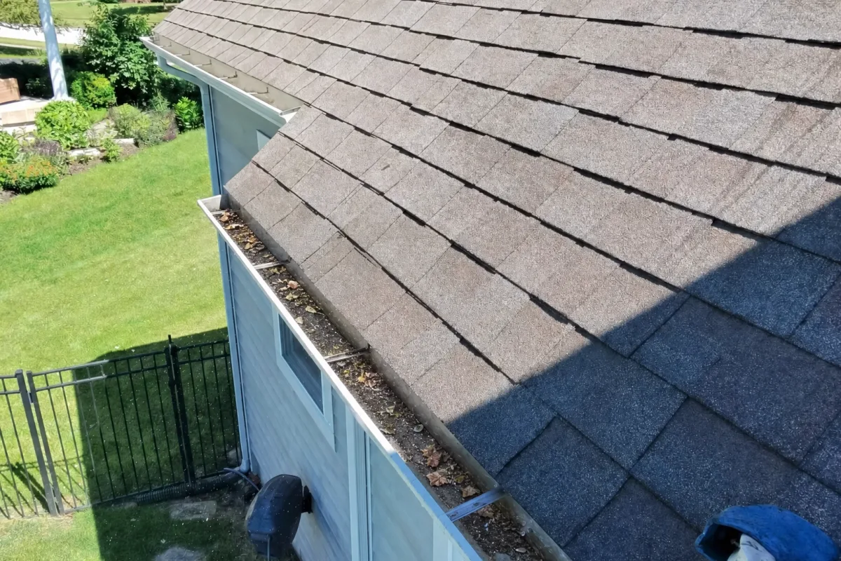 Gutter Cleaning before — Cary IL 2-story house