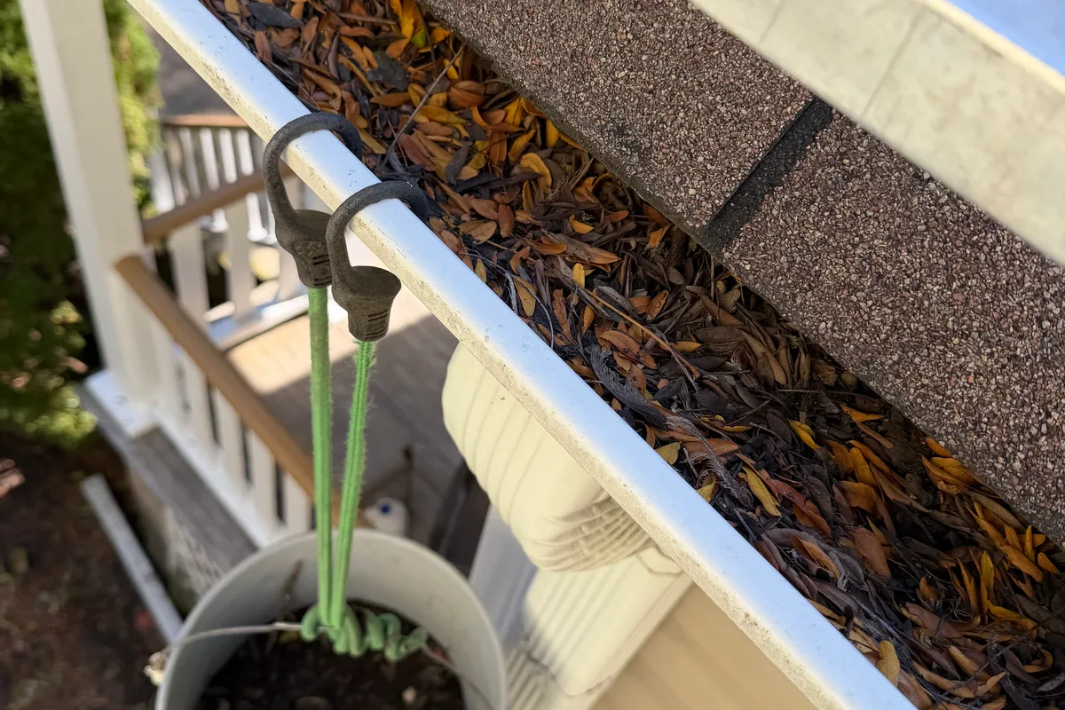 Gutter Cleaning before — Chicago IL 2-story house