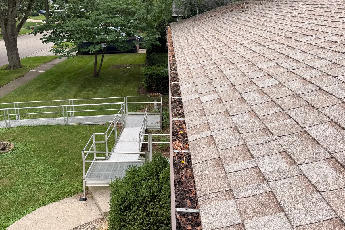 Gutter Cleaning before — Crystal Lake IL 2-story house