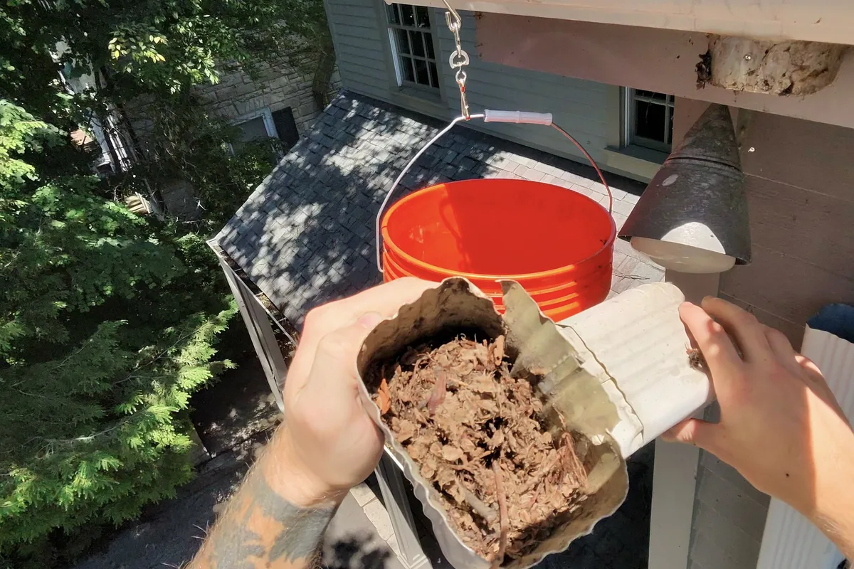 Gutter Cleaning before — Kenilworth IL 2-story house