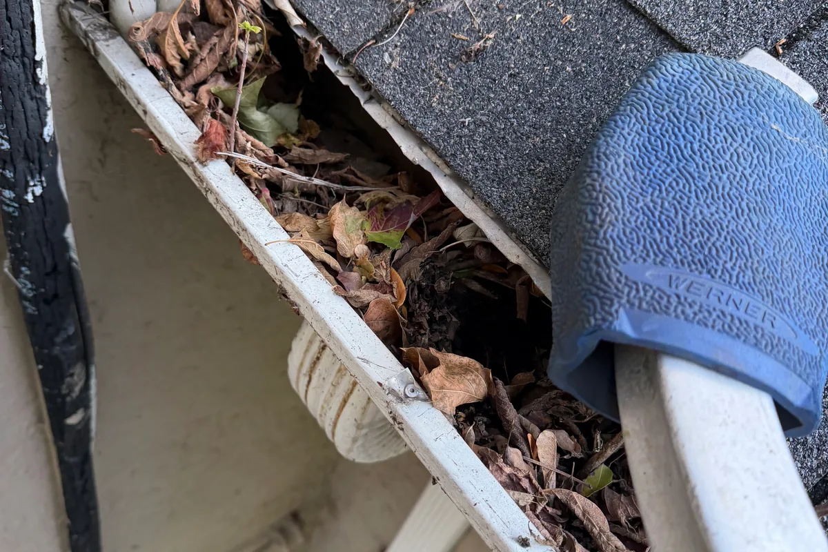 Gutter Cleaning before — Kenilworth IL 2-story house