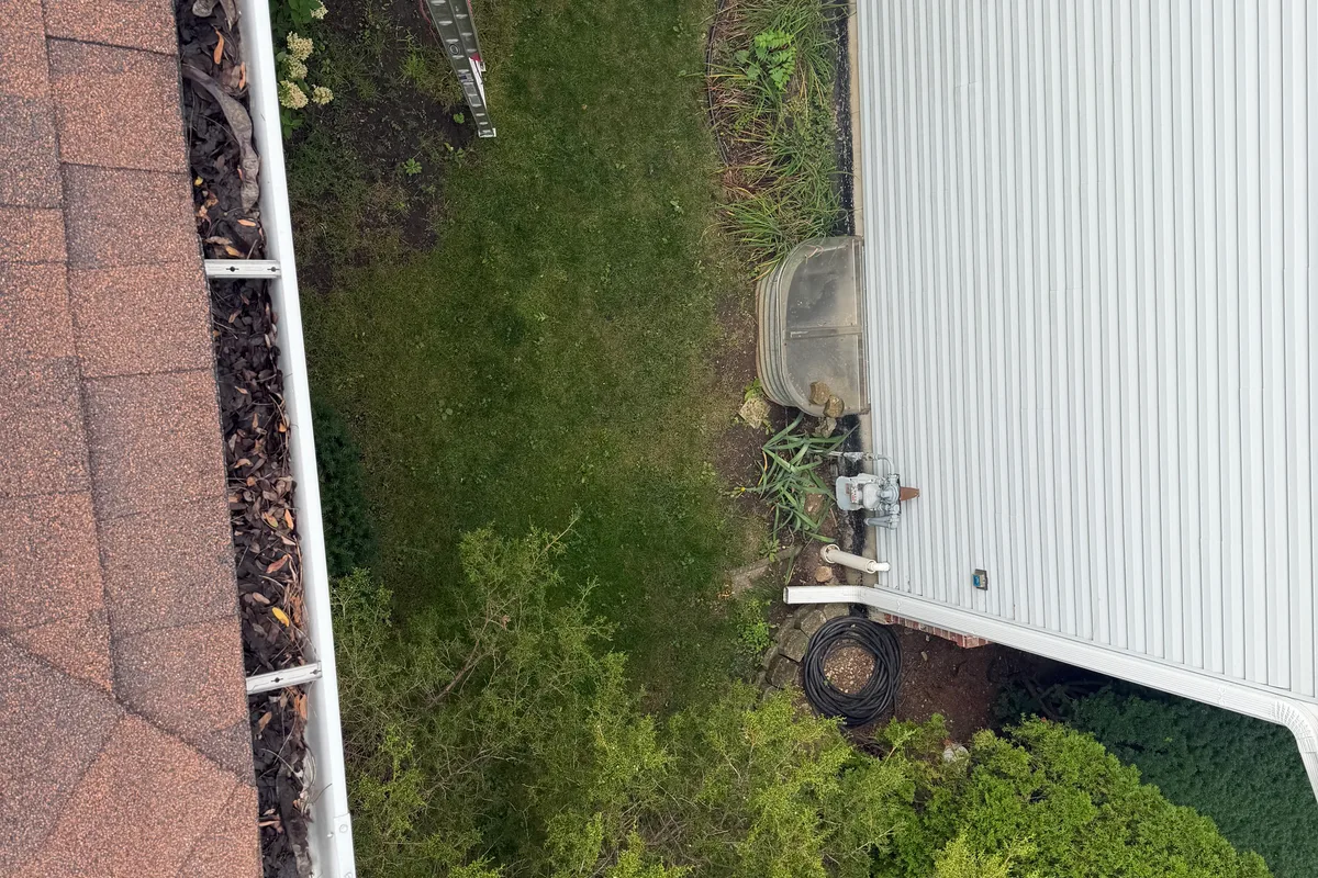 Gutter Cleaning before — Mundelein IL 2-story house