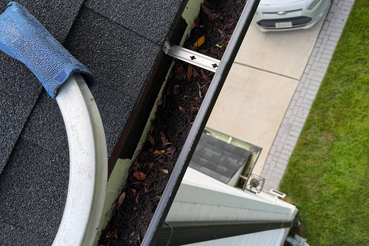 Gutter Cleaning before — Northbrook IL 2-story house
