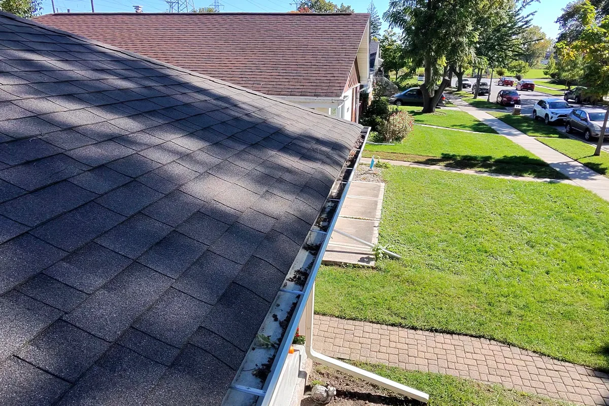 Gutter Cleaning before — Skokie IL 1-story house