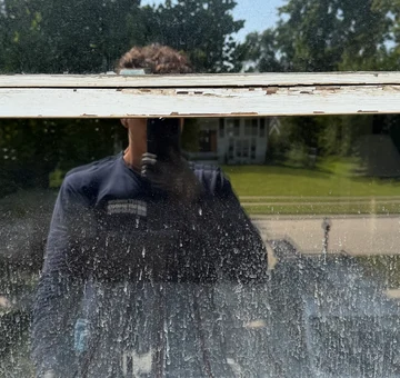 Window washing before &mdash; spotted glass on a two-story house in Lombard, IL